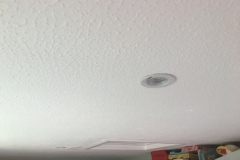 Textured / artex ceiling visible in multiple rooms